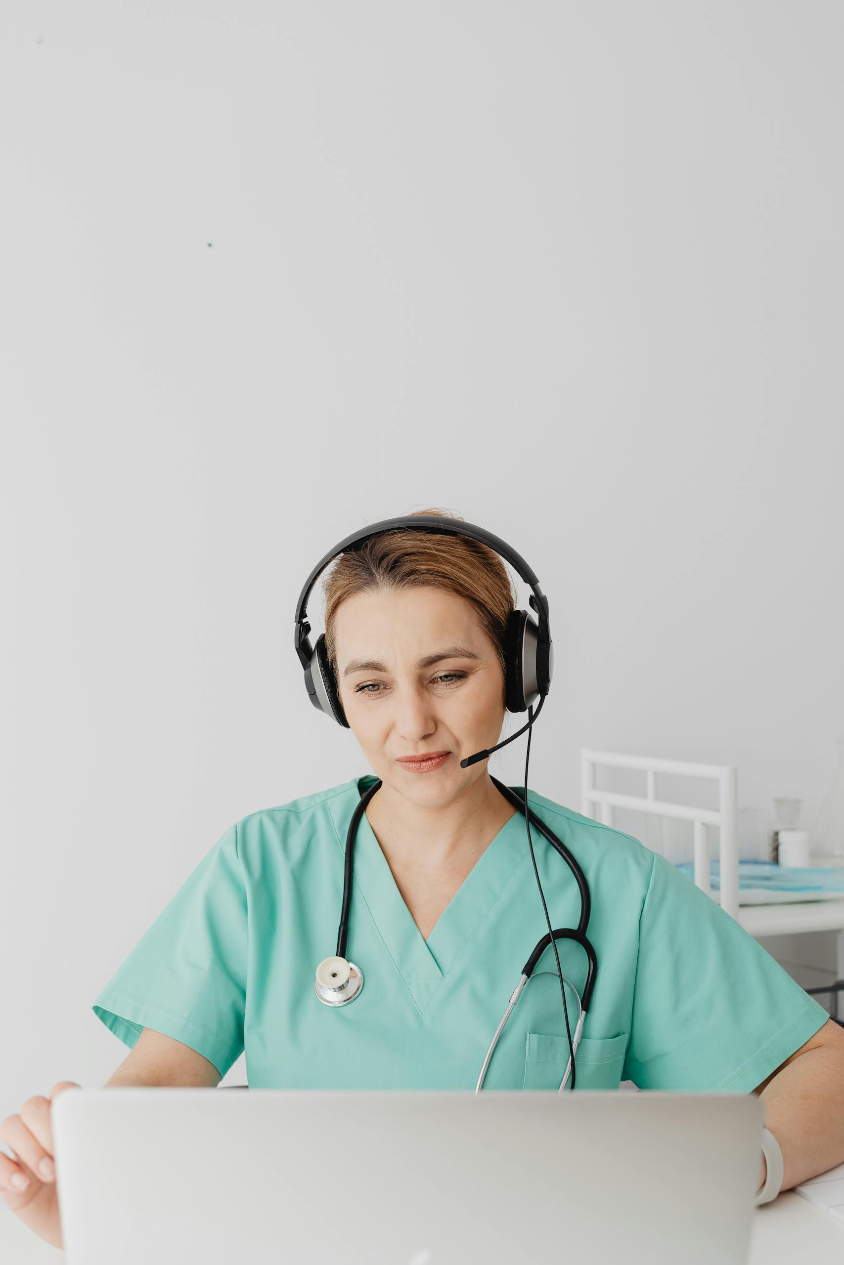 Doctor Talking to Patient Using Internet and Laptop